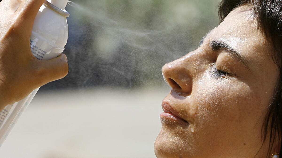 Dermatologists share how to reapply sunscreen over makeup using SPF powders, sprays, sticks and sponges without smudging your foundation.