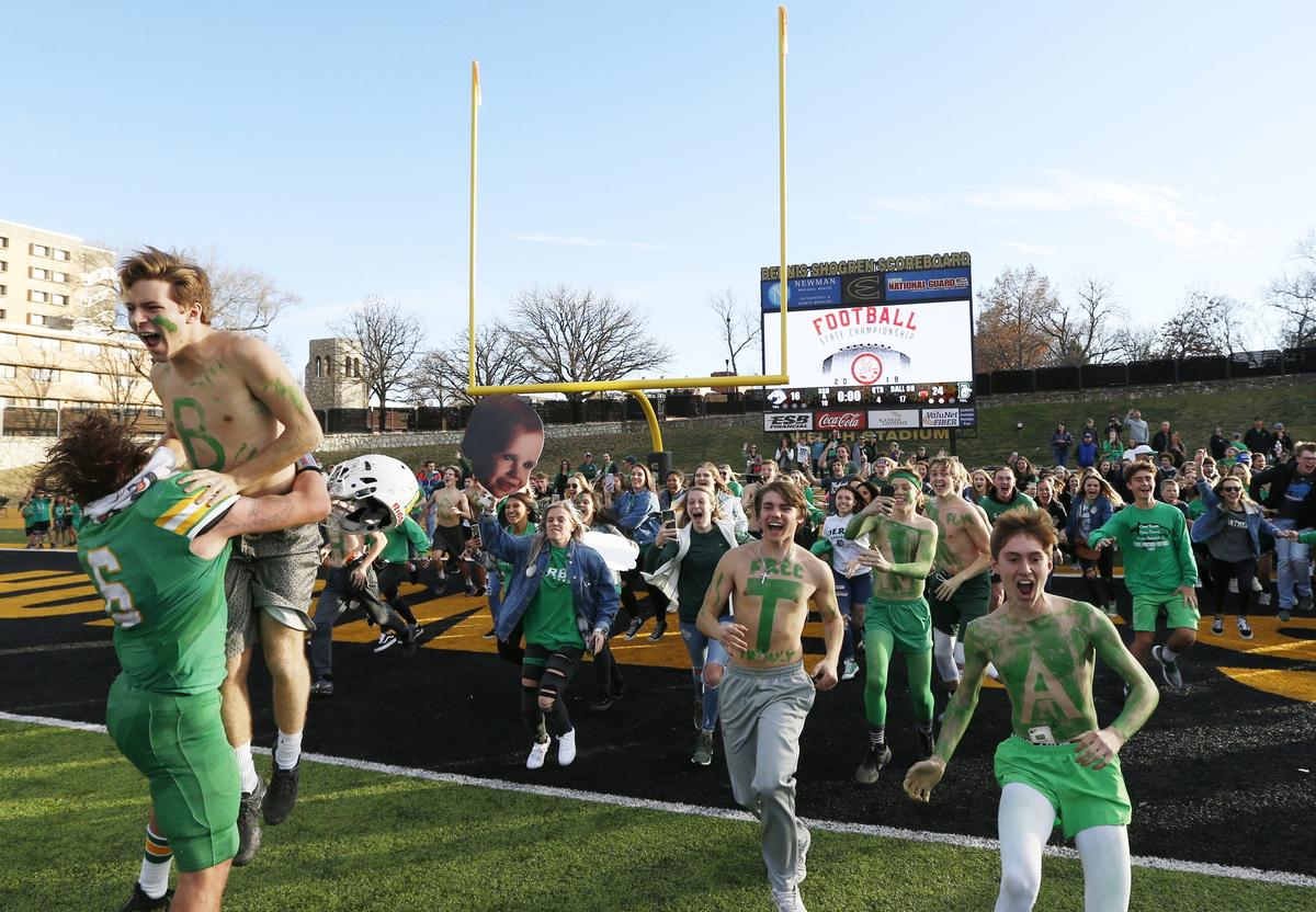 Derby High fans rush the field after Derby clinched the 6a title against Blue Valley North Saturday in Emporia 24-16 (November 24, 2018)