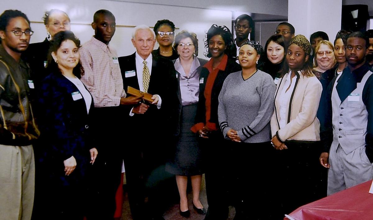 One glass-walled corner of the new High Aspirations youth mentoring headquarters has been deemed “The Henrys Room.” At the back of the room is a nearly 20-year-old photo of Henry Wash standing next to Henry Bloch. Wash is the founder of the organization that is finally getting its own space after mentoring hundreds of African American boys since 2004 through weekly meetings at libraries and churches. Bloch, the now 96-year-old co-founder of H&R Bloch, inspired the organization through his own mentoring of Wash.