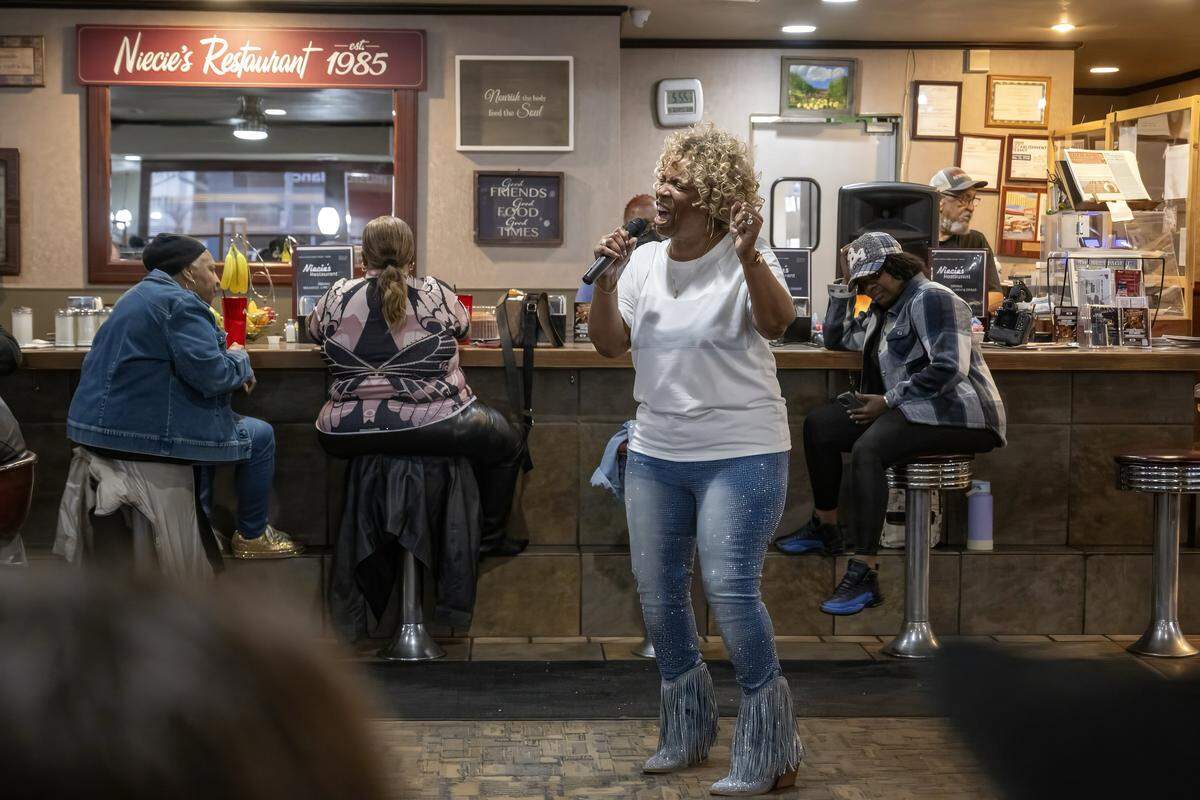 Denise “Ms. Niecie” Ward performs old-school hits during “Dinner & A Show” at Niecie's Restaurant in Kansas City on Friday, Feb. 6, 2026. Ward performs on the First Friday of every month at her soul food restaurant.