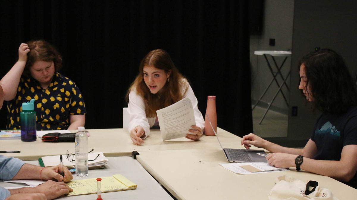 During a session of the Spinning Tree Theatre’s Young Playwrights Lab, actors M.J. Bradshaw, from left) and Riley Martin perform Gabe Baethke’s work as he takes notes on things to adjust.