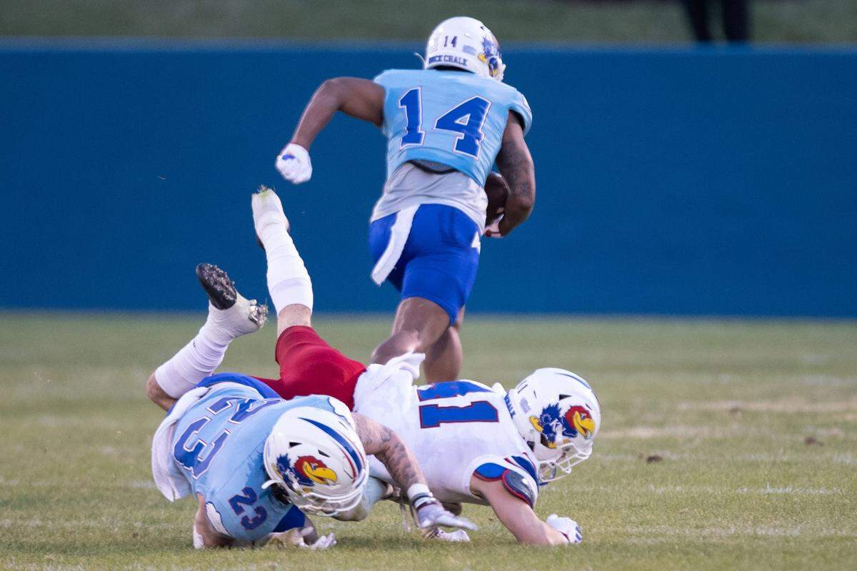 Kansas redshirt-junior safety Jalen Dye (14) runs in for a touchdown after making an interception during the Spring Showcase at Rock Chalk Park on April 12, 2024.