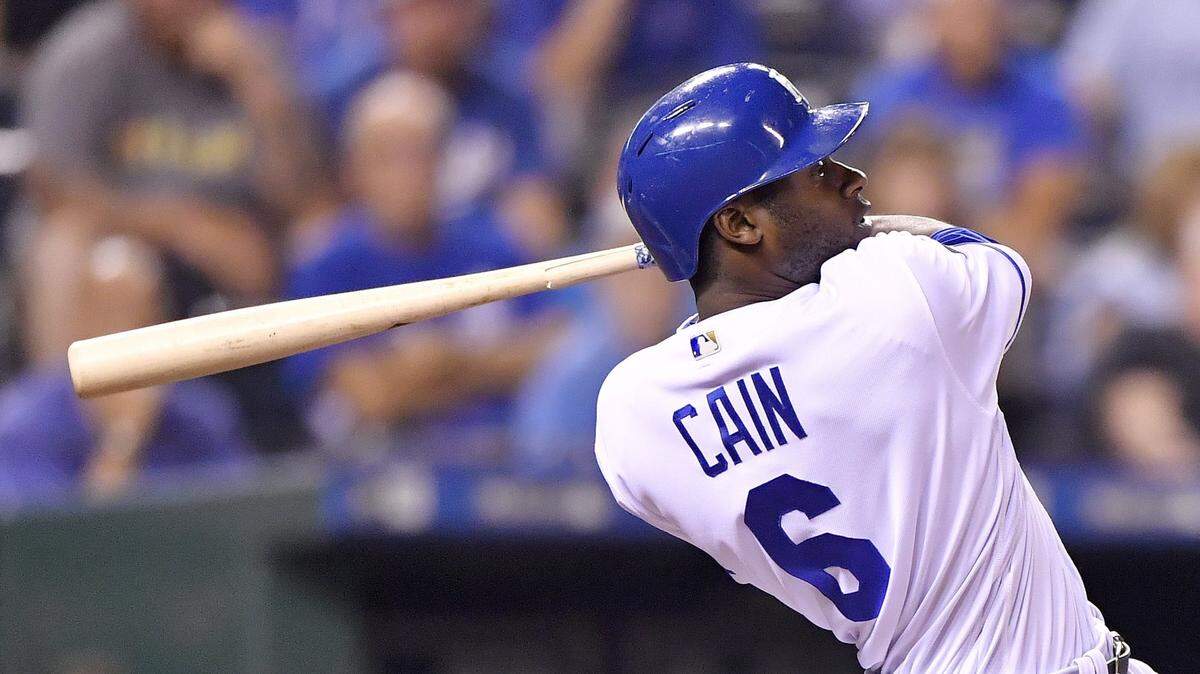 Kansas City Royals’ Lorenzo Cain follows through on a single to score Whit Merrifield in the fifth inning during Monday’s baseball game against the Chicago White Sox at Kauffman Stadium in Kansas City, Mo.