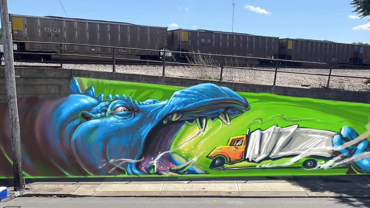 A hippo eats a truck in concept art for a mural at the Independence Ave. truck-eating bridge in Kansas City. Alex Eickhoff of Eye Cough Art created the design.