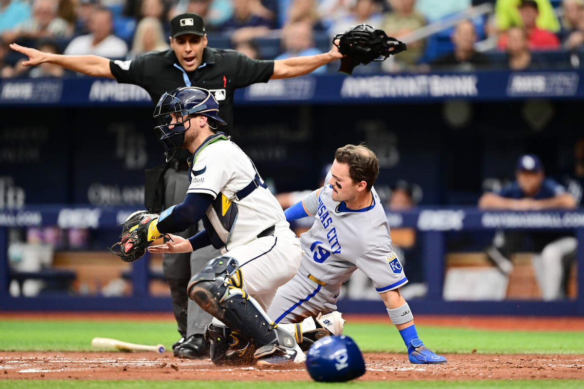 Michael Massey #19 of the Kansas City Royals slides in safely before Nick Fortes #40 of the Tampa Bay Rays can make the tag in the second inning at Tropicana Field on June 22, 2026 in St Petersburg, Florida.