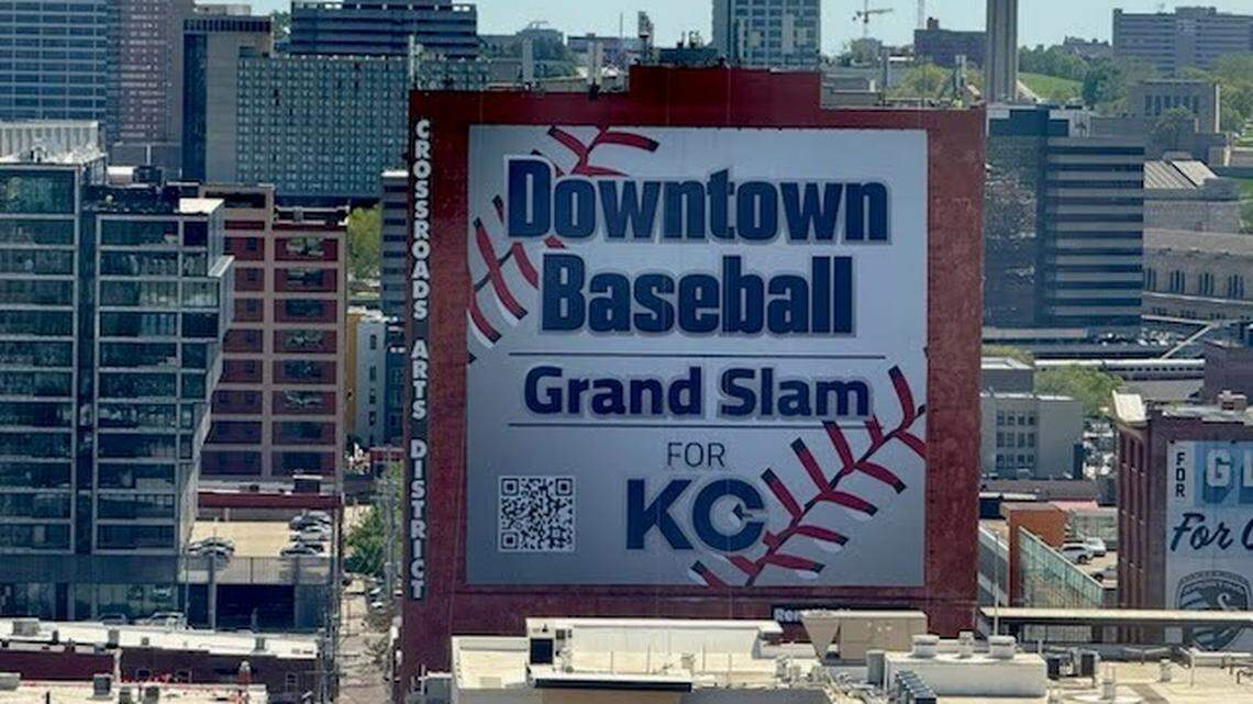 More than two dozen Kansas City businesses and individuals paid to display a massive sign urging the Royals to choose downtown for their new stadium, highlighting Washington Square Park as a top spot.