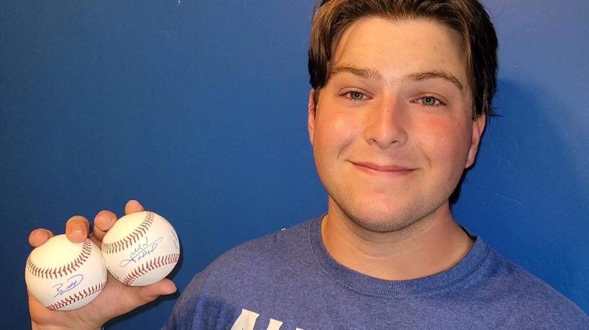 Bruce Williams with the baseballs the Royals game him.