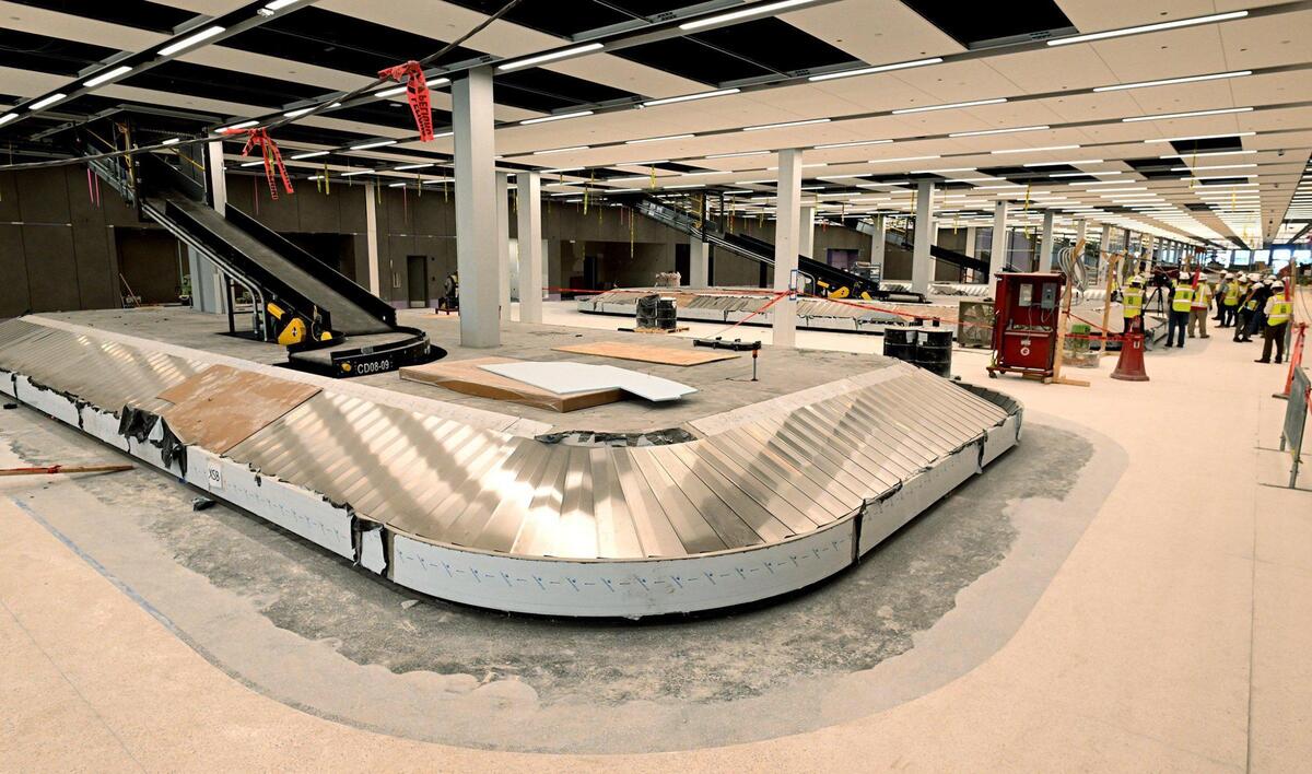 Construction on the new Kansas City International Airport continues and is about 90 percent complete. The airport is slated to open in March of 2023 and feature 39 gates. Above is the massive baggage claim area with direct exits to the covered pickup lanes and parking garage..