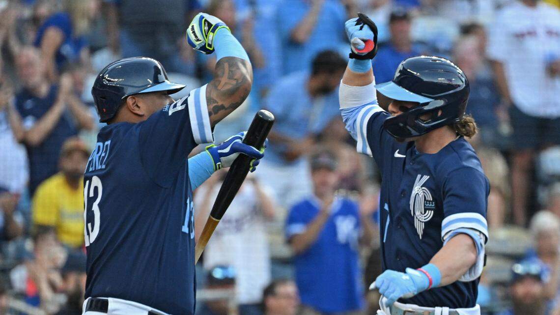Sep 1, 2023; Kansas City, Missouri, USA; Kansas City Royals shortstop Bobby Witt Jr. (7) celebrates with Salvador Perez (13) after hitting a solo home run in the first inning against the Boston Red Sox at Kauffman Stadium.