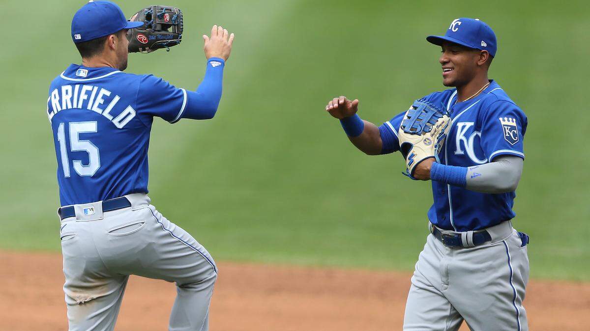 Kansas City Royals’ Whit Merrifield (15) celebrates with teammate Edward Olivares after their win over the Minnesota Twins during a baseball game Sunday, May 30, 2021, in Minneapolis. (AP Photo/Stacy Bengs)