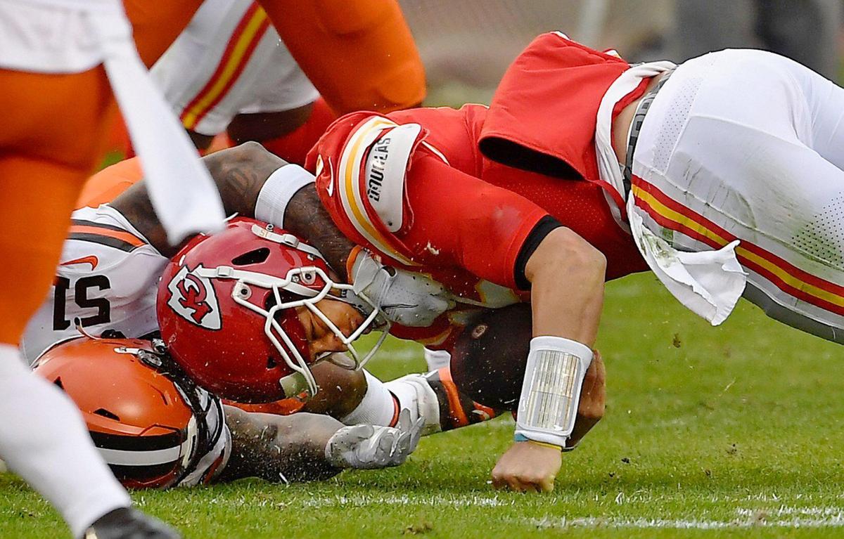 Kansas City Chiefs quarterback Patrick Mahomes is hit hard by Cleveland Browns outside linebacker Mack Wilson in the third quarter Sunday, January 17, 2021, at Arrowhead Stadium in Kansas City, Missouri. Mahomes was injured on the play and did not return to the game.