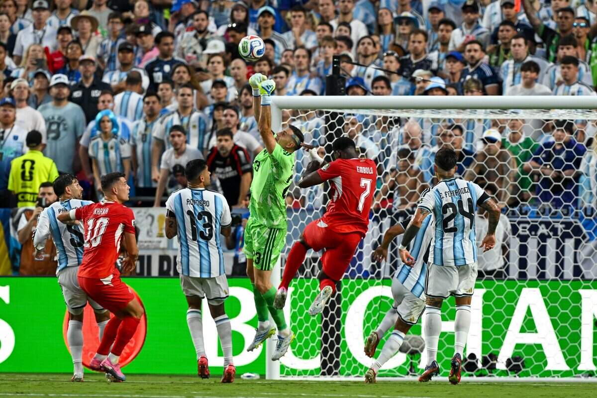 Argentina goalkeeper Emiliano Martínez (23) makes a save in the first half of the Argentina vs. Switzerland 2026 World Cup Quarterfinal football match at Kansas City (Arrowhead) Stadium in Kansas City on Saturday, July 11, 2026.