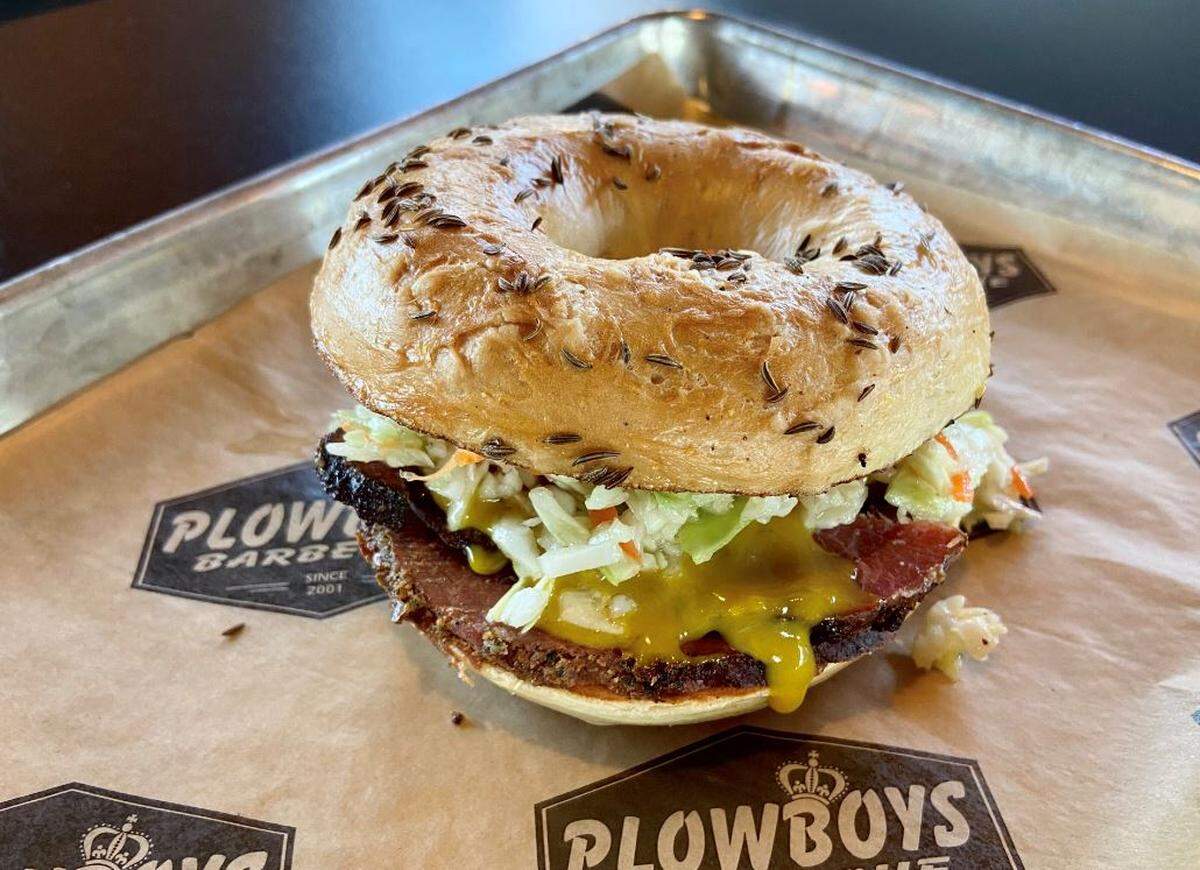 Plowboys’ “Rub Me for Luck” sandwich. Its own smoked pastrami with its Bovine Bold rub and Helga Sweet Heat Mustard on a rye bagel from Meshuggah Bagels.