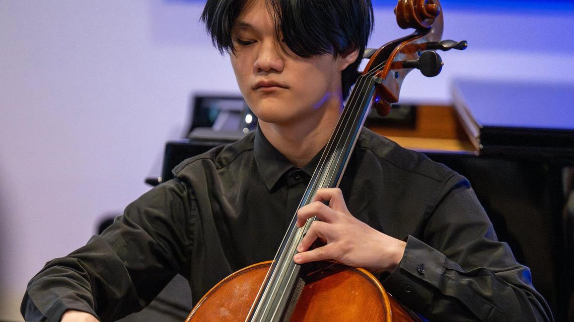 Cellist John Lee of the Tesura String Quartet recently performs during a benefit concert held at the Kansas City residence of arts philanthropist Benny Lee.