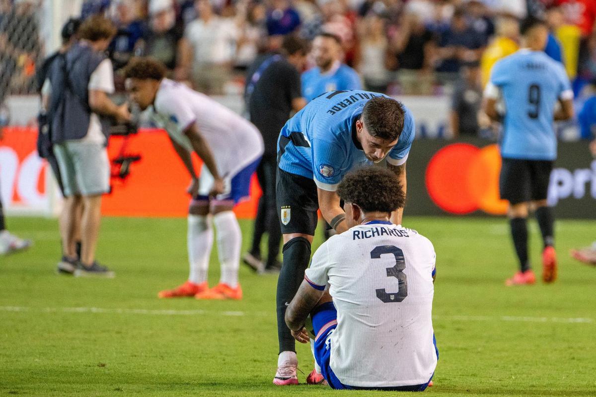 Uruguay midfielder Federico Valverde (15) shakes hands with United States defender Chris Richards (3) after defeating the United States 1-0 in a Copa America match at GEHA Field at Arrowhead Stadium on Monday, July 1, 2024, in Kansas City.