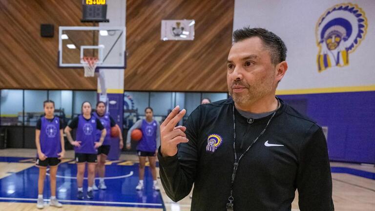 Trump’s firings cost Kansas coach his job. Now, he works unpaid as team fights for victory