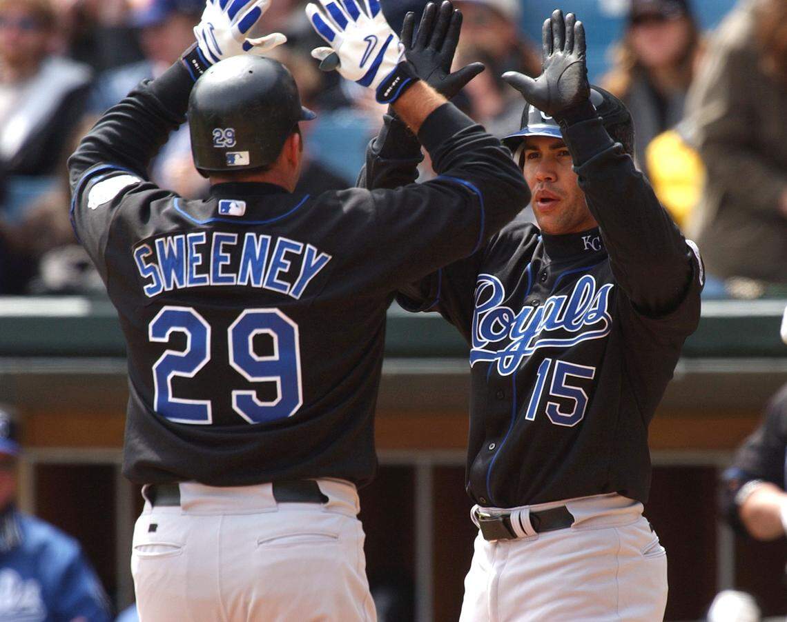 Center fielder Carlos Beltran #15 of the Kansas City Royals celebrates with teammate Mike Sweeney #29 after Sweeney hit a two-run home run in the third inning against the Chicago White Sox on April 13, 2004 at U.S. Cellular Field in Chicago, Illinois. The White Sox defeated the Royals 12-5.