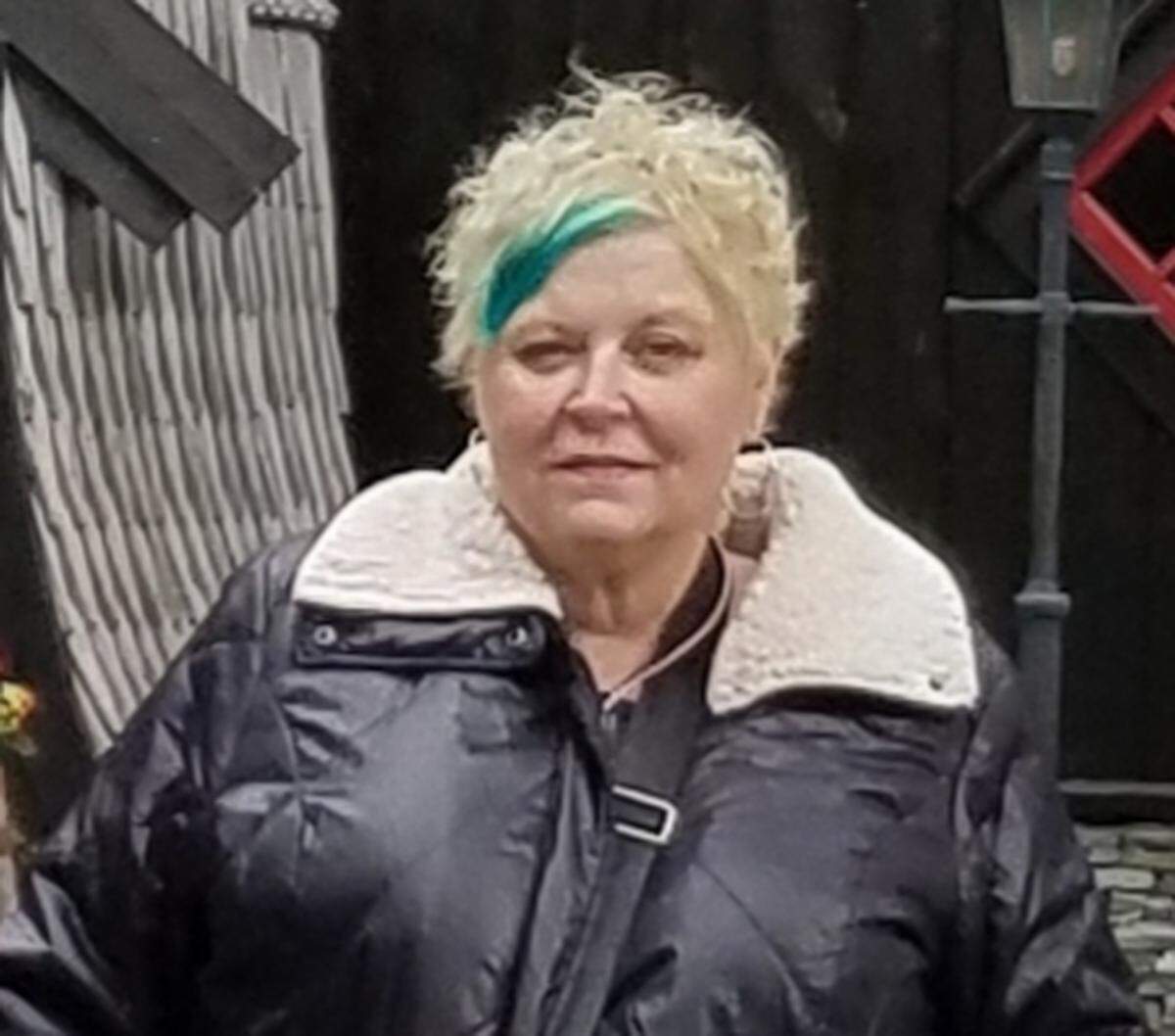 Renee Dietchman, a retired psychologist in Merriam, was diagnosed with lung cancer in August 2017. She wears a mask when she goes out in public now.