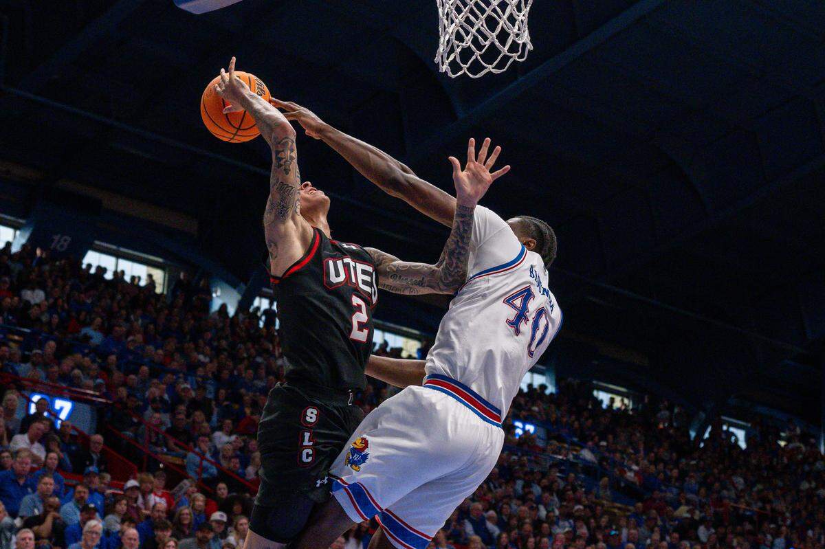 Kansas Jayhawks forward Flory Bidunga (40) blocks the shot of Utah Utes guard Terrence Brown (2) in the first half on Saturday, February 7, 2026, at Allen Fieldhouse.