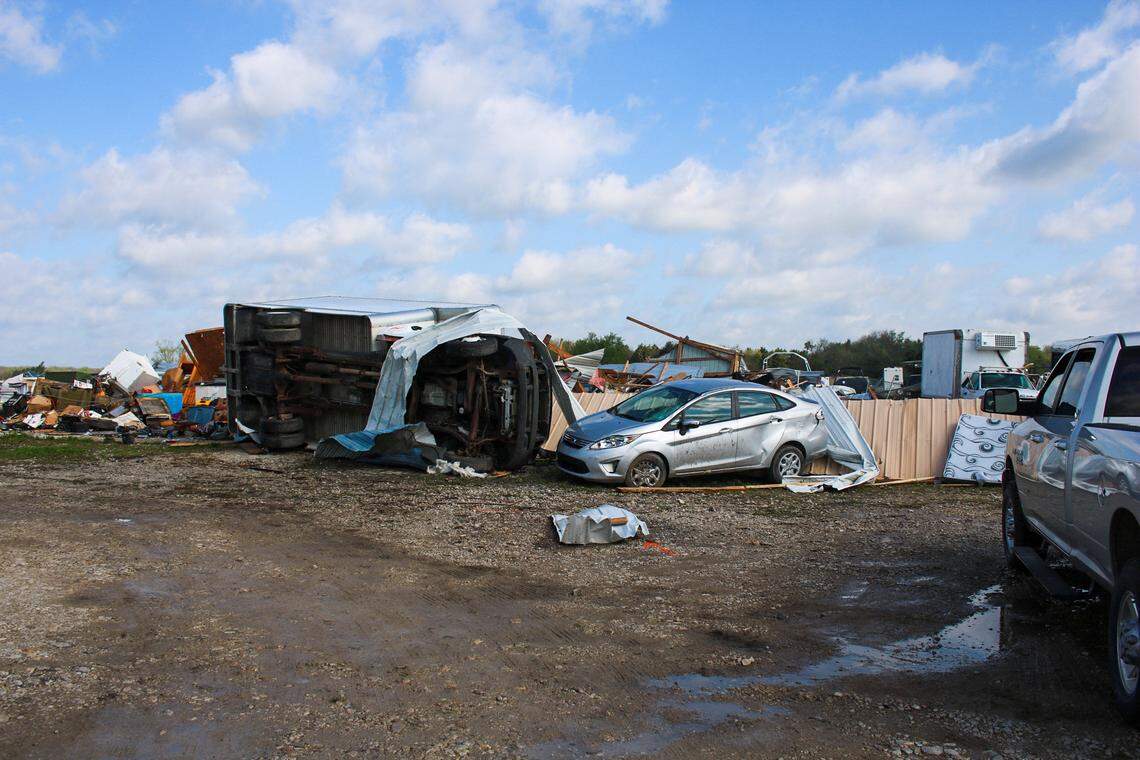 Vehicles are seen flipped over and damaged amid rubble near Hillsdale Boat and Mini Storage on April 14, 2026.