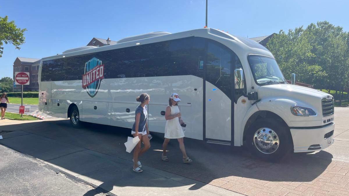 A new bus service linking Overland Park, Lenexa and Kansas City International Airport is expected to launch ahead of World Cup matches in Kansas City next year. This photo shows a Johnson County United-branded bus at a World Cup kickoff event in Overland Park in June.