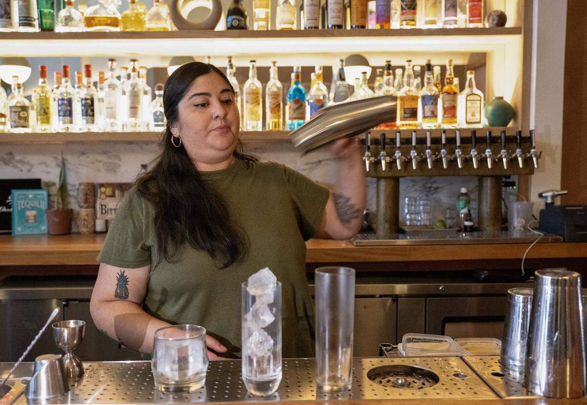 Diana Condori, a bartender at Fern Bar, shakes up a cocktail on Thursday, March 5, 2026. Condori is a 2026 James Beard Award nominee for Outstanding Professional in Cocktail Service.