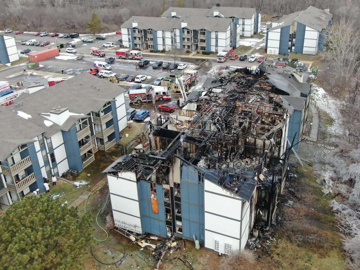 Firefighters remained on the scene after an early morning fire destroyed an apartment building in a complex in the 19000 block of East 37th Terrace, north of the Independence Commons shopping center on Wednesday, Jan. 22, 2025.
