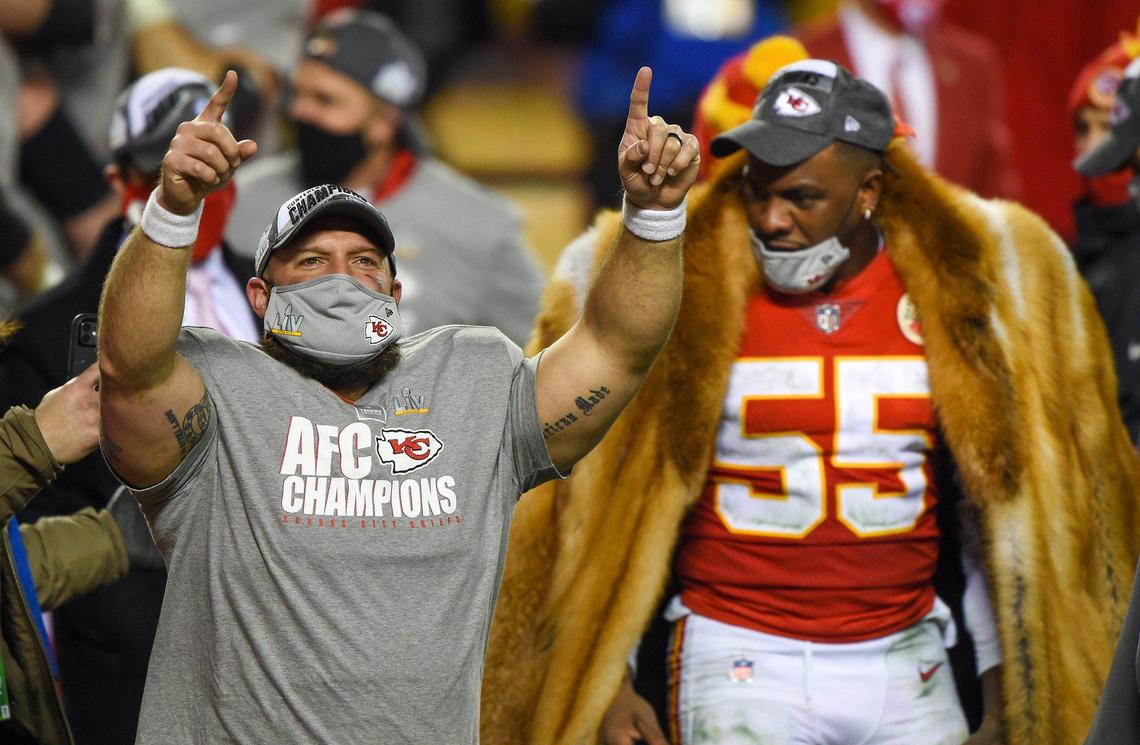Kansas City Chiefs fullback Anthony Sherman (42) and defensive end Frank Clark celebrate after the Chiefs won the AFC Championship Game, 38-24, over the Buffalo Bills on Sunday, Jan. 24, 2021, at Arrowhead Stadium in Kansas City.
