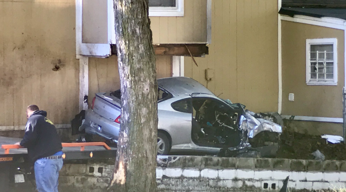 Four teenagers were injured when a car they were in crashed into a house near Smart and Jackson avenues in Kansas City.