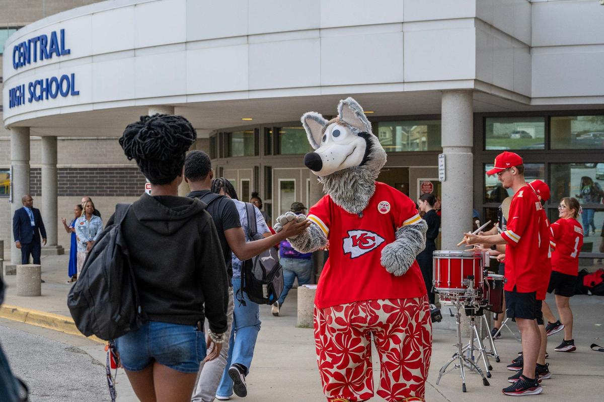 Kansas City Chiefs mascot K. C. Wolf welcomes students to the first day of school along with the Chiefs Rumble team at Central High School on Monday, Aug. 19, 2024, in Kansas City.