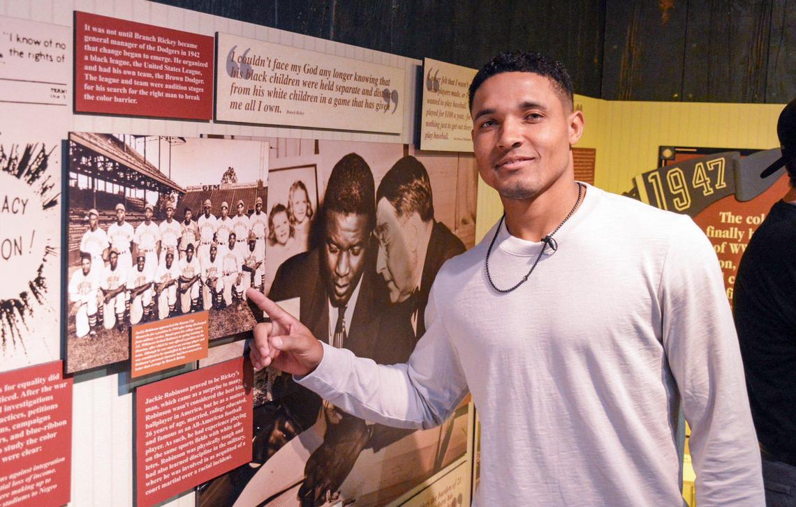 Baltimore Orioles shortstop Richie Martin points at a picture of his grandfather, Walter Thomas, part of the Negro Leagues Baseball Museum exhibit.