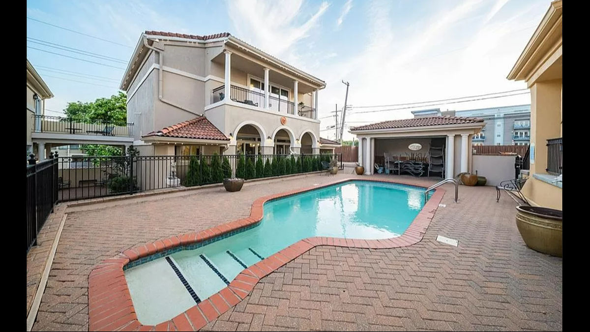 The pool outside 4 E. 51st St. is a part of the Villa D’Este Condominiums, which includes the three-story home available by Chartwell Realty