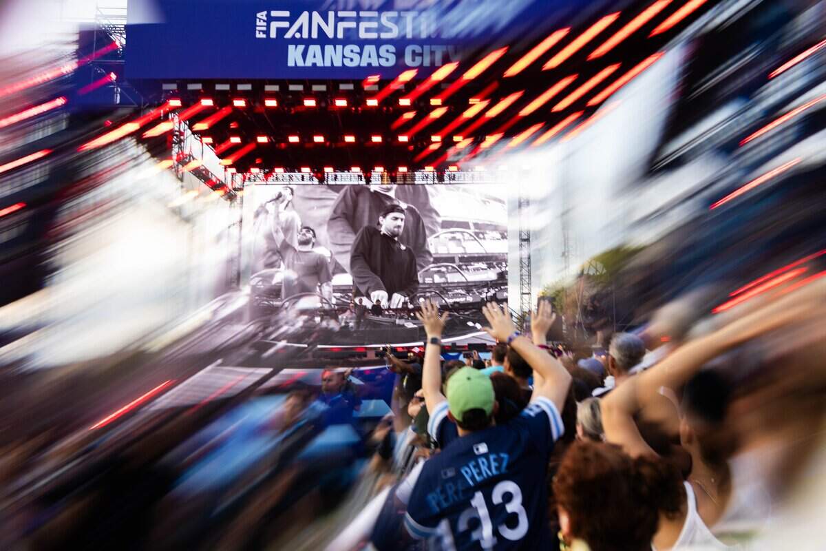The crowd holds their arms out during the FIFA Fan Fest Chainsmokers concert at Fan Fest on Sunday, June 21, 2026.