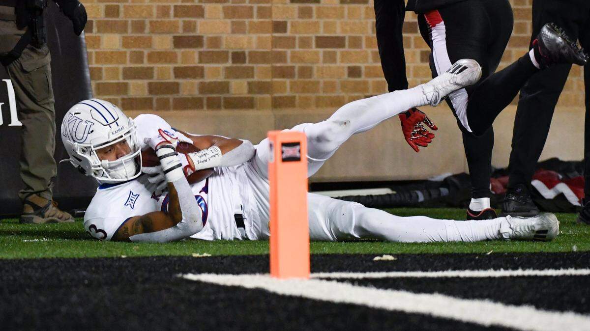 Kansas wide receiver Quentin Skinner slides out of bounds with a second-half touchdown against Texas Tech on Nov. 12 in Lubbock, Texas.
