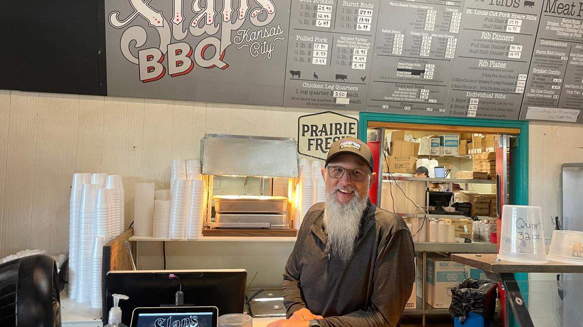 Mike Pearce stands behing the counter of Slap’s BBQ, the award-winning Kansas City, Kansas, restaurant he and his brother, Joe, opened in 2014.
