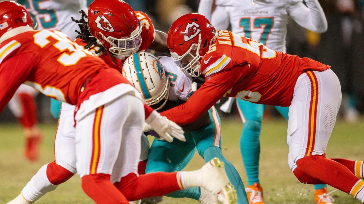 Kansas City Chiefs defensive end George Karlaftis (56) tackled Miami Dolphins wide receiver Tyreek Hill (10) in the second quarter during an AFC Wild Card game on Saturday, Jan. 13, 2024, in Kansas City.
