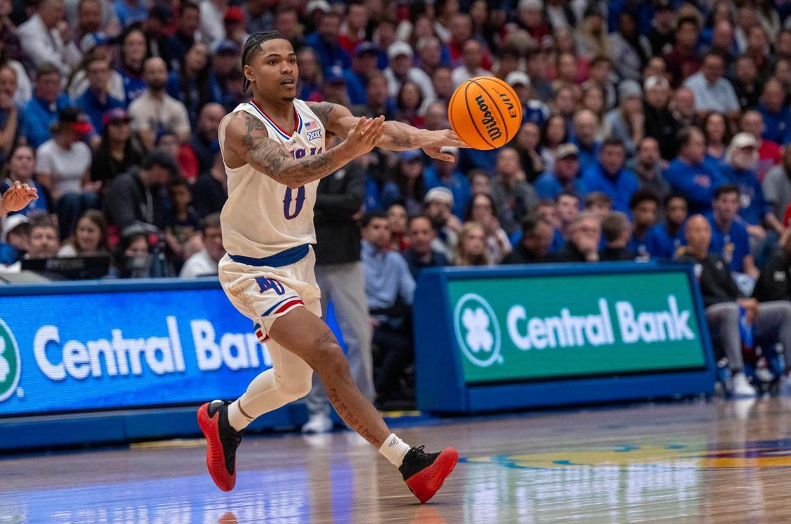 Kansas Jayhawks guard Shakeel Moore passes during a college basketball game against the Arizona State Sun Devils at Allen Fieldhouse on Wednesday, Jan. 8, 2025, in Lawrence, Kansas.