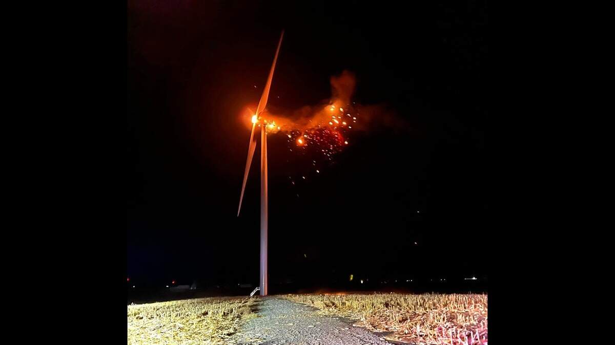 A wind turbine caught fire near Williamsburg, Iowa, officials said. Burning debris caused a field surrounding the turbine to catch fire as well.