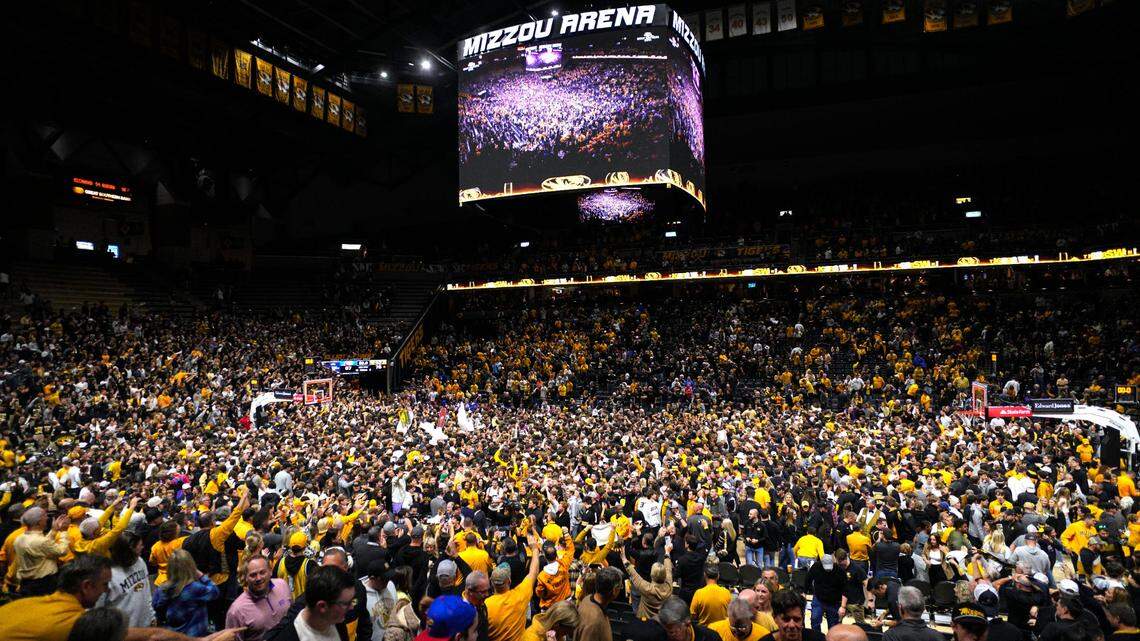 Missouri Tigers fans storm the court after defeating the Kansas Jayhawks at Mizzou Arena on Dec. 8, 2024.
