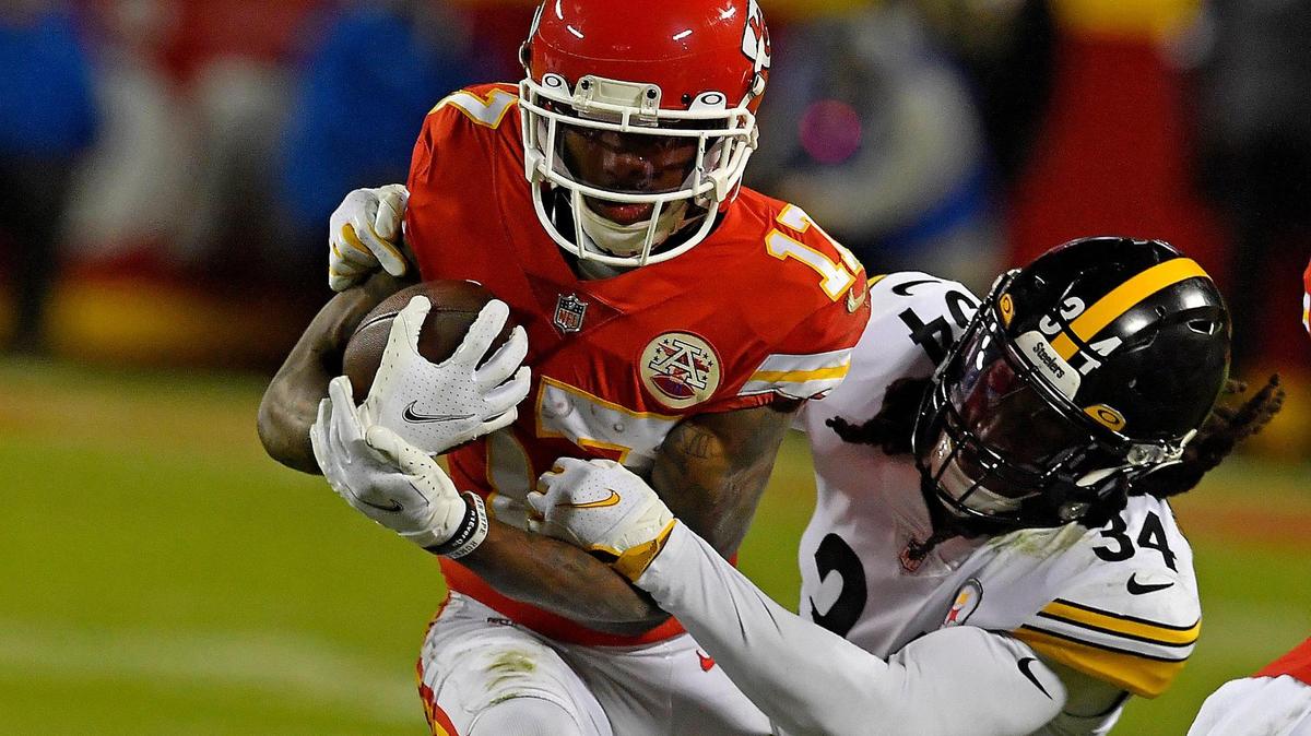 The Chiefs Mecole Hardman, left, tries to break away from Pittsburgh tackler Terrell Edmunds during the second half of Sunday night’s AFC Wild Card playoff game at Arrowhead Stadium. Kansas City beat Pittsburgh, 42-21.
