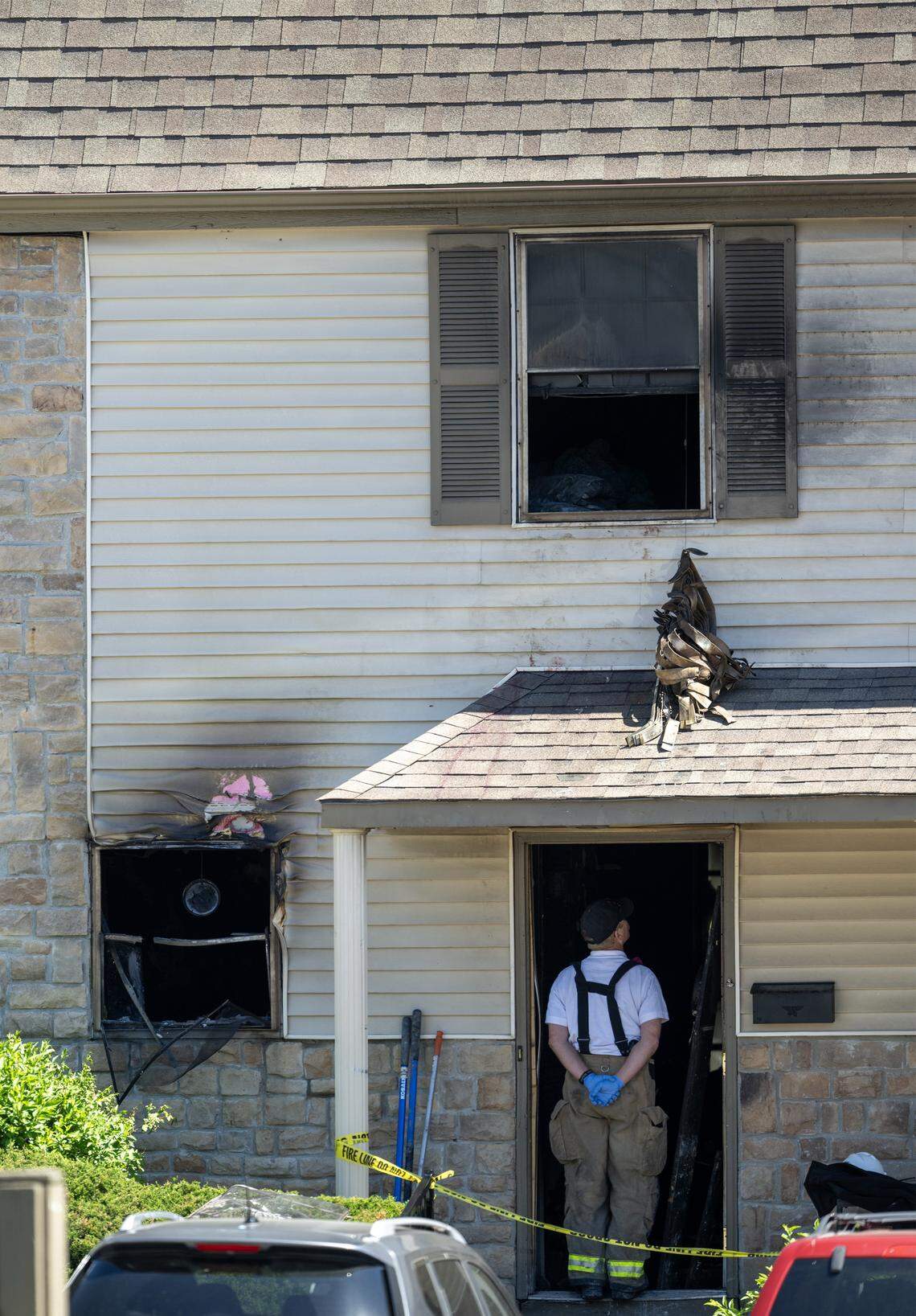 Overland Park firefighters investigate an early-morning apartment fire at Sheridan Ridge Apartments in the 8300 block of Farley Street on Saturday, April 18, 2026. Five people, two adults and three children, were taken to the hospital. One adult and three children were listed in critical condition, while the second adult was believed to have less serious injuries, according to the Overland Park Fire Department.