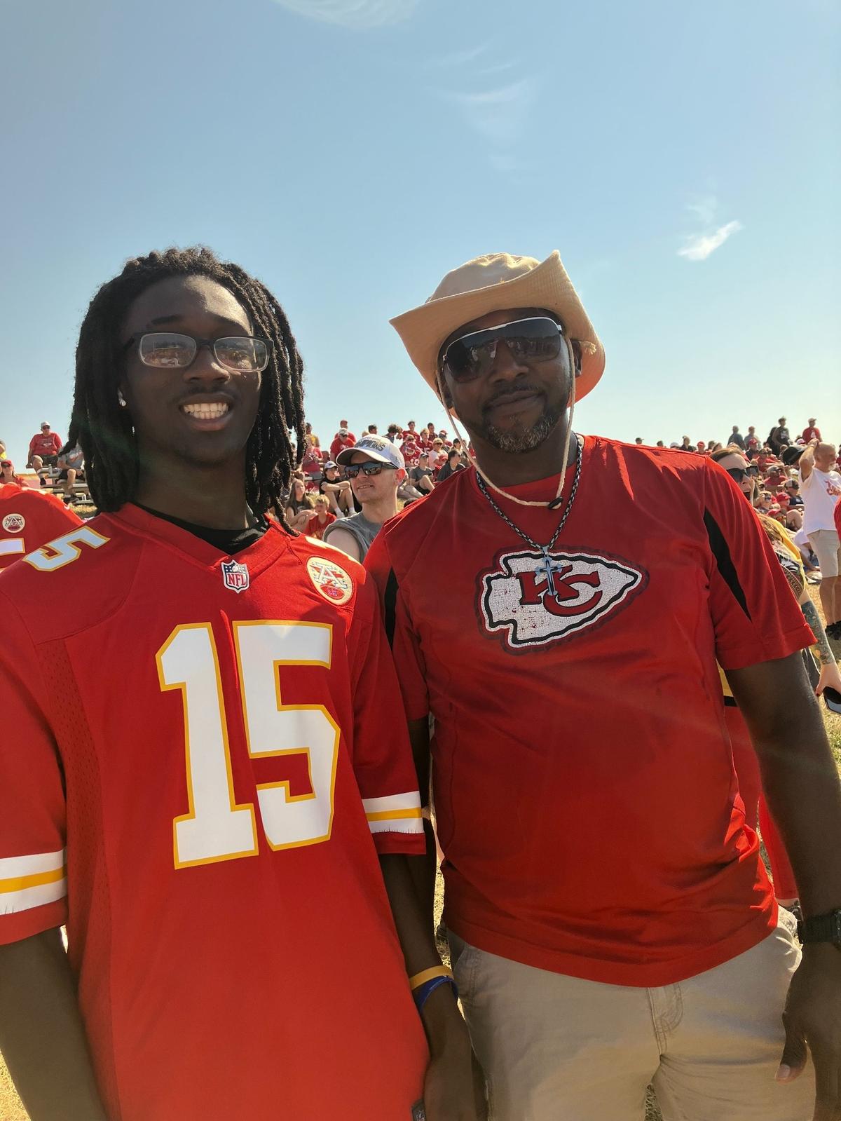 Kansas City Chiefs fans Xavier Fisher, left, and his father, Myron Fisher attended their favorite team’s training camp.