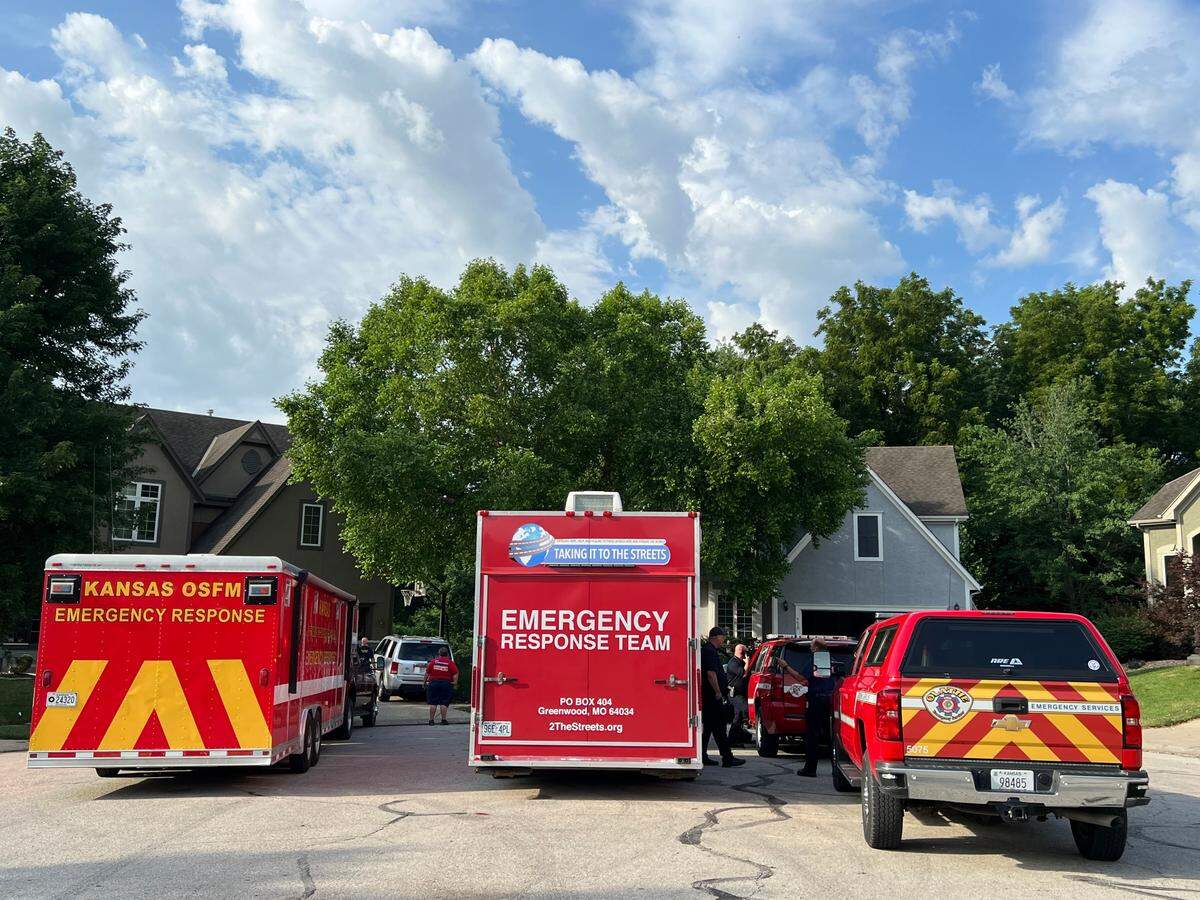 Authorities investigate a house fire near Grove and Silverheel streets in Shawnee.
