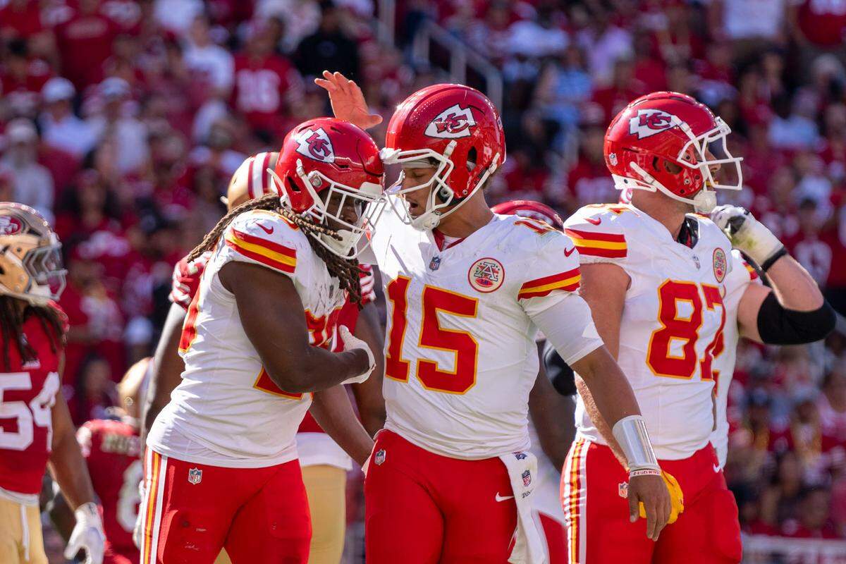 Kansas City Chiefs running back Kareem Hunt (29) is congratulated by quarterback Patrick Mahomes (15) after scoring a touchdown against the San Francisco 49ers during the second quarter at Levi’s Stadium.