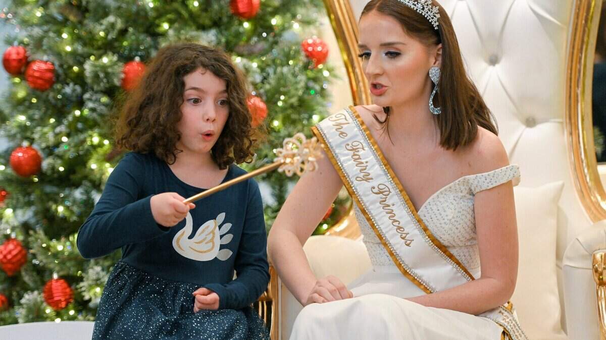 Sylvia Rialti, 7, of Olathe wished for a golden retriever puppy for Christmas during her visit with Fairy Princess Olivia Pikul last year in the Betty Milbank Waldrop Salon at the Kansas City Museum. The Fairy Princess will return Dec. 7-10.