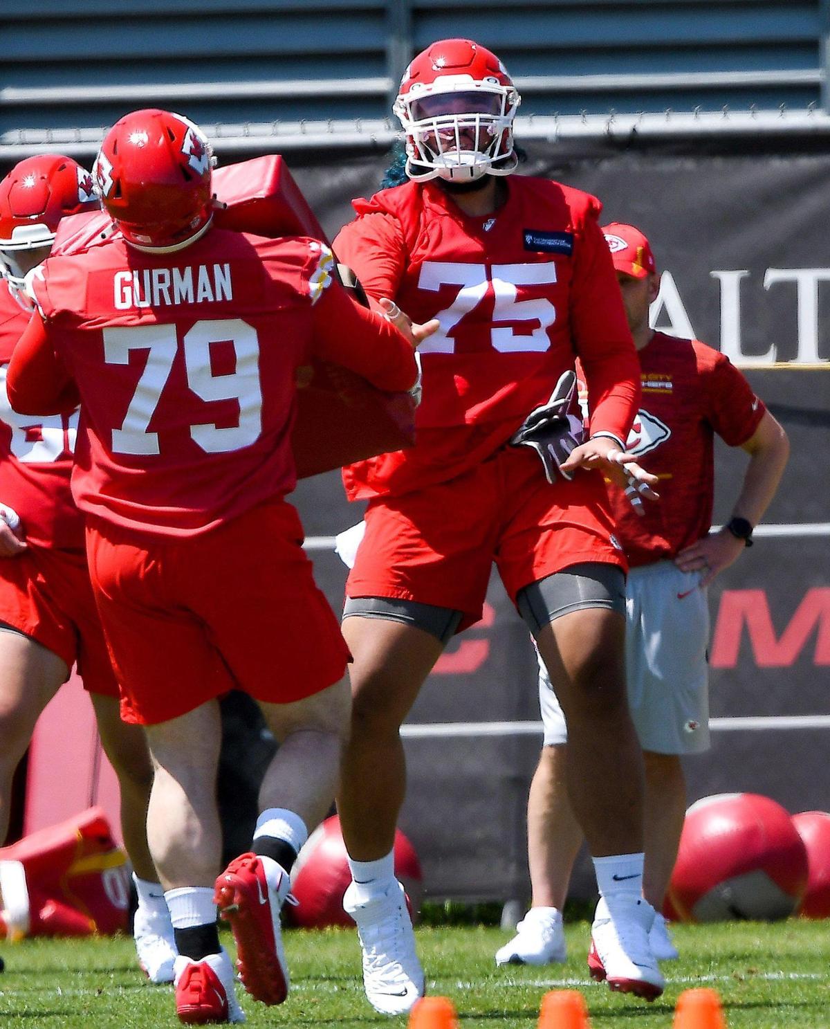Tackle Darian Kinnard (75) and guard Vitaliy Gurman (79) participated in drills on the first day of the Kansas City Chiefs rookie minicamp at the training facility Saturday, May 7, 2022.