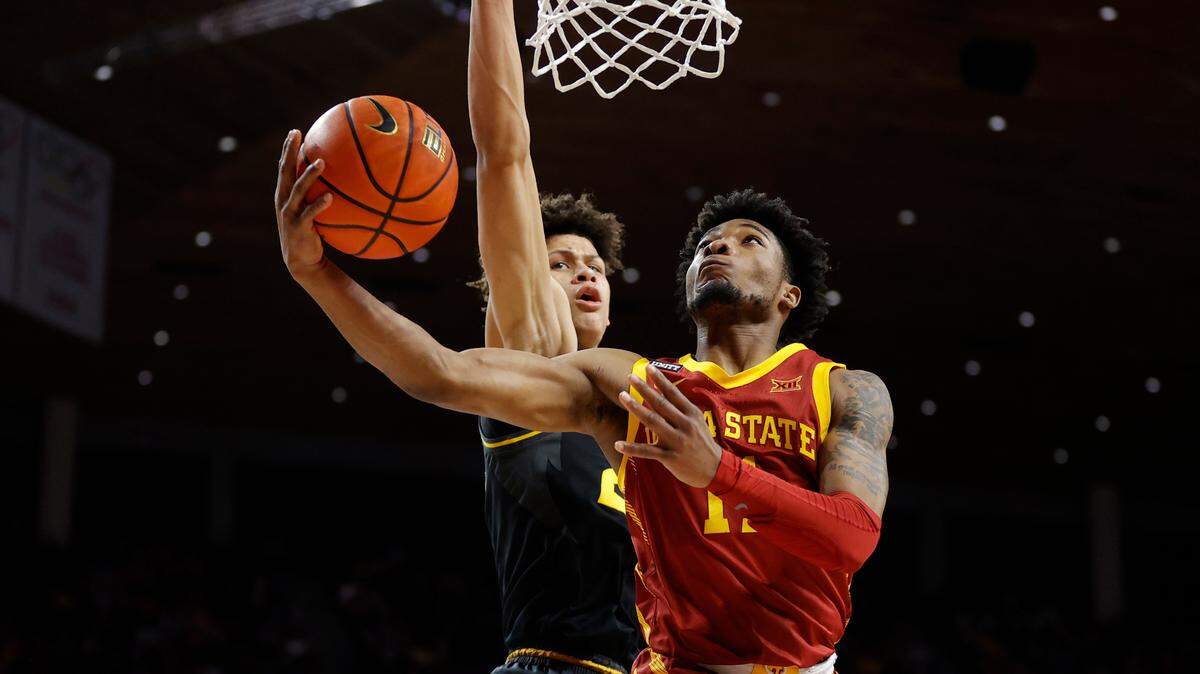 Iowa State guard Tyrese Hunter (11) finds a basket past Missouri forward Trevon Brazile (23) during the first half of an NCAA college basketball game, Saturday, Jan. 29, 2022, in Ames. (AP Photo/Matthew Putney)