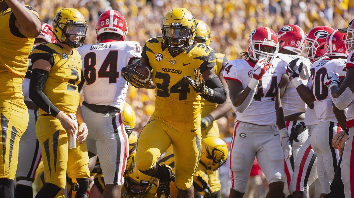 Missouri running back Larry Rountree III, center, celebrates after scoring a touchdown during the first half of an NCAA college football game against Georgia Saturday, Sept. 22, 2018, in Columbia, Mo. (AP Photo/L.G. Patterson)