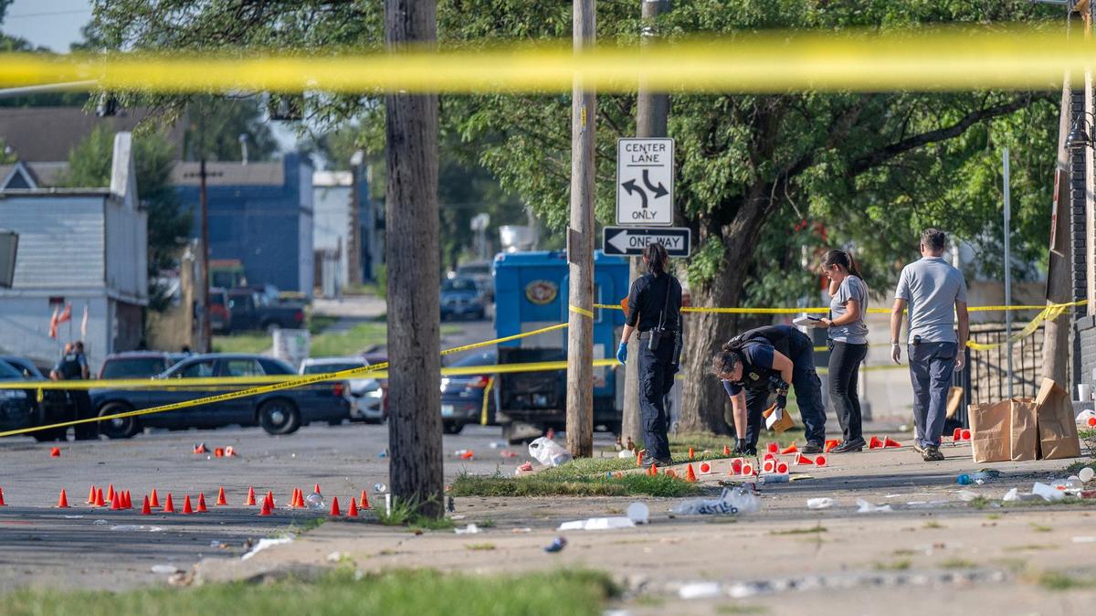 Cones mark evidence at a shooting scene where Kansas City police investigated an early morning shooting on Aug. 5 near East 70th Street and Prospect Avenue. Dyamund Shields Jr., who was working out of his food truck Chicken Mac-N-Cheese, was killed when gunfire erupted. Five others were injured.