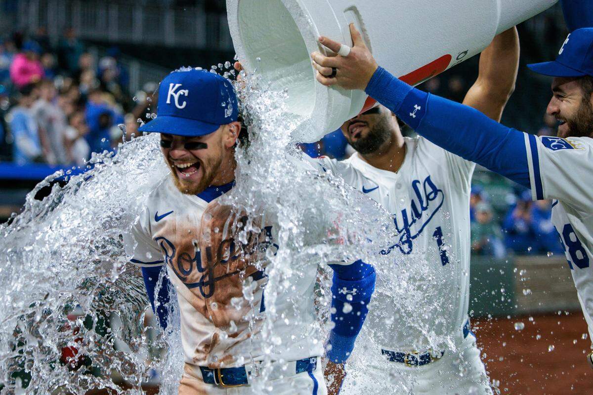 Kansas City Royals shortstop Bobby Witt Jr. (7) is doused with water after the game against the Minnesota Twins at Kauffman Stadium on April 8, 2025.